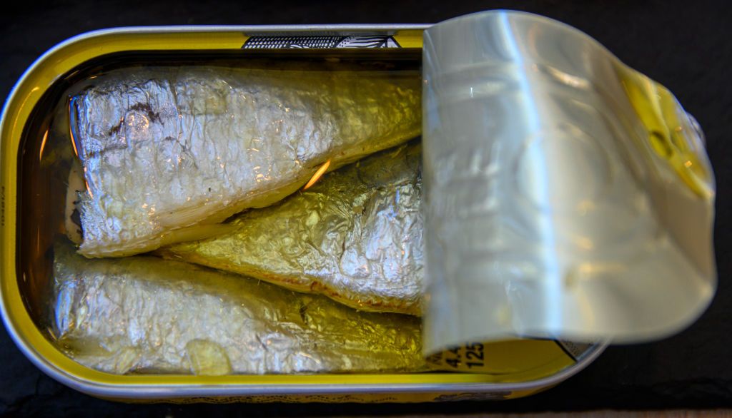 MATOSINHOS, PORTUGAL - JULY 17: An open tin of canned sardines produced by Conservas Portugal Norte cannery on July 17, 2019 in Matosinhos, Portugal. Fishing is a major economic activity in Portugal with a long tradition and has some of the highest fish consumption per capita rates in the world. (Photo by Horacio Villalobos - Corbis/Corbis via Getty Images)