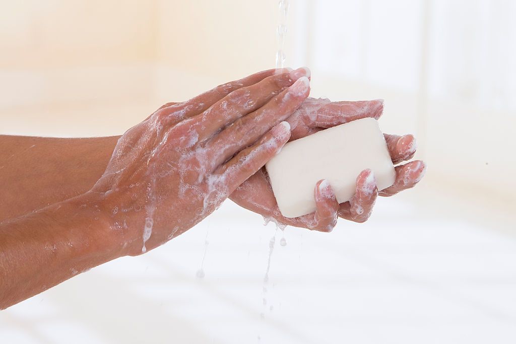 Woman washing her hands (Photo by: BSIP/Universal Images Group via Getty Images)